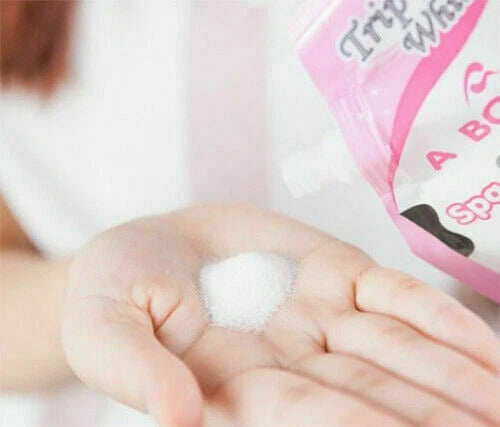 A Bonne Spa Milk Salt texture on hand showing exfoliating granules