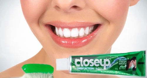 Closeup image of a smiling person promoting Closeup Menthol Fresh Toothpaste