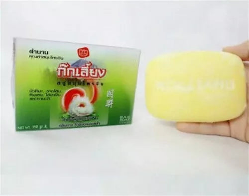 Kokliang Herbal Soap Anti Acne bar and box showing natural yellow herbal soap texture