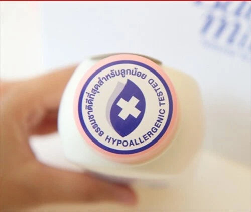 Top view of Babi Mild White Sakura Baby Powder bottle showing the hypoallergenic tested label.