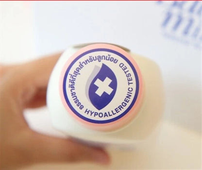 Top view of Babi Mild White Sakura Baby Powder bottle showing the hypoallergenic tested label.