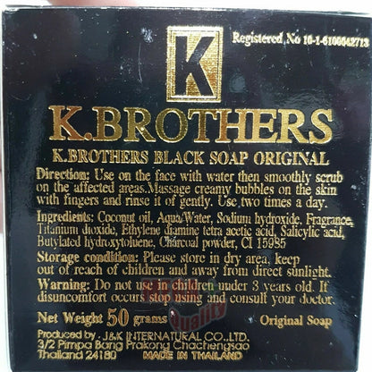 Close up of the K Brothers Black Spot Soap bar showing embossed lettering and ingredients