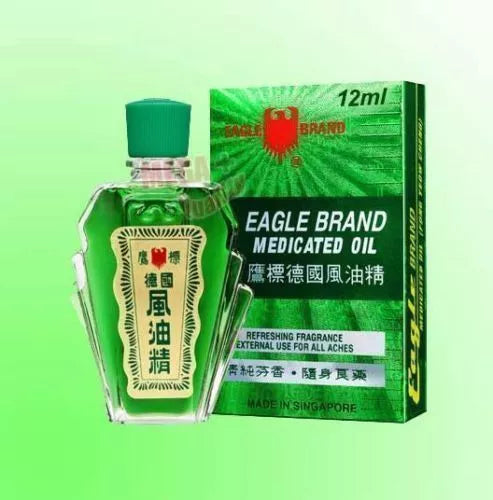 Eagle Brand Medicated Oil in a 12ml green glass bottle, packaged in a branded box, ideal for pain relief.