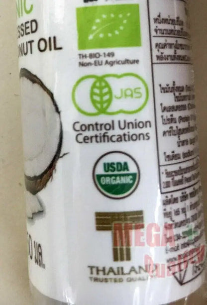 Tropicana Virgin Coconut Oil packaging with organic certifications for hair and skin moisturising.