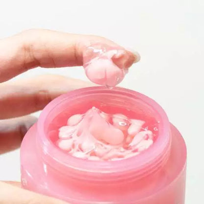 Medicube PDRN Pink Collagen Capsule Cream texture with visible pink capsules on spatula