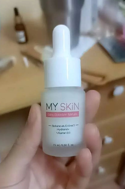MY SKIN Glow Booster Serum bottle held in hand close up