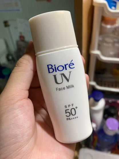  Biore UV Perfect Face Milk sunscreen held in hand close-up