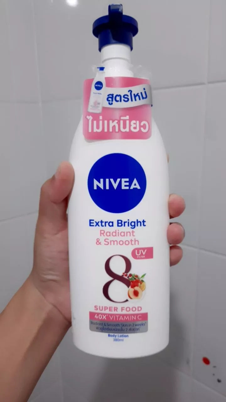 Nivea Radiant Smooth Lotion bottle hand holding front view