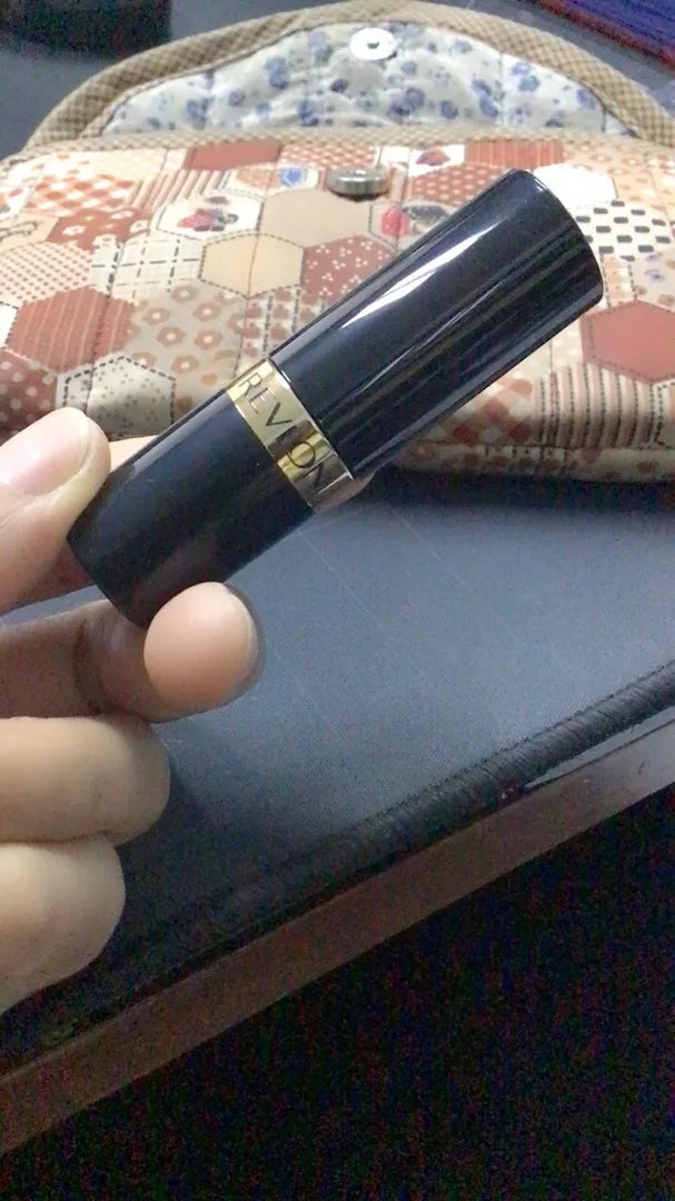 Revlon Super Lustrous Lipstick application on lips smooth color finish close up