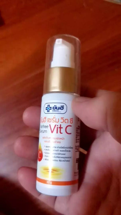 Yanhee Vit C Serum bottle held in hand demonstrating size and design