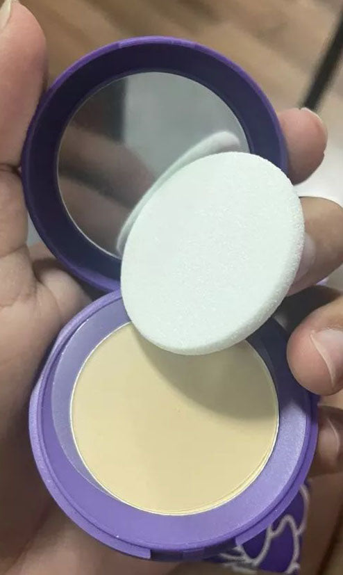 Srichand Translucent Powder texture powder close up with puff
