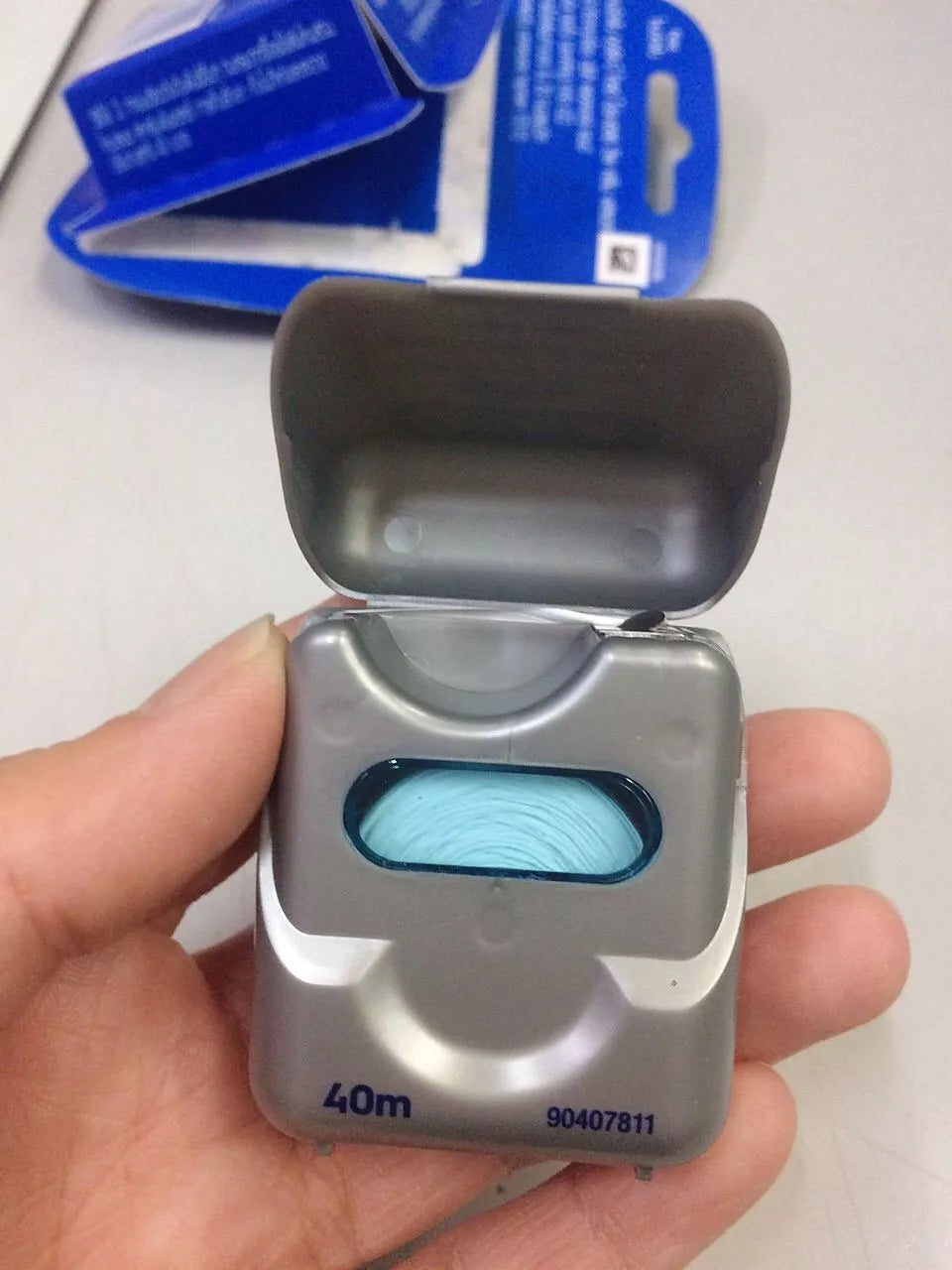 Oral-B Glide Floss open case showing floss dispenser inside