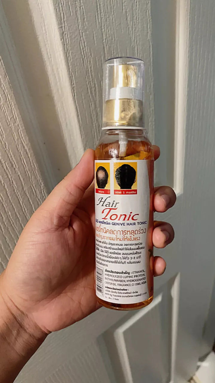 Hand holding GENIVE Hair Tonic spray bottle 120ml