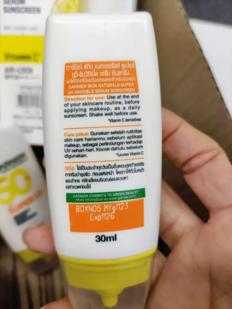 Garnier Super UV Serum sunscreen SPF50 PA++++ tube back label held in hand