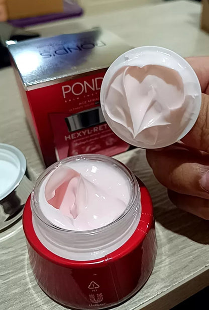 Pond 's Age Miracle Night Cream open jar with inner seal and cap