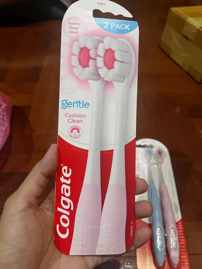 Colgate Cushion Clean Toothbrush packaged pair close up with Colgate logo and soft bristle tips