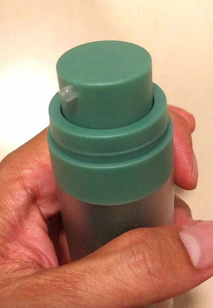 Opened INGU Retinol Serum Shot bottle showing pump and cap details
