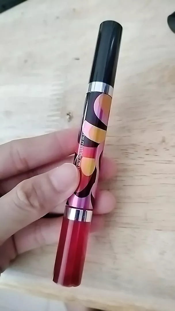 Mistine Dream Lip Tint handheld product showing dual tip design