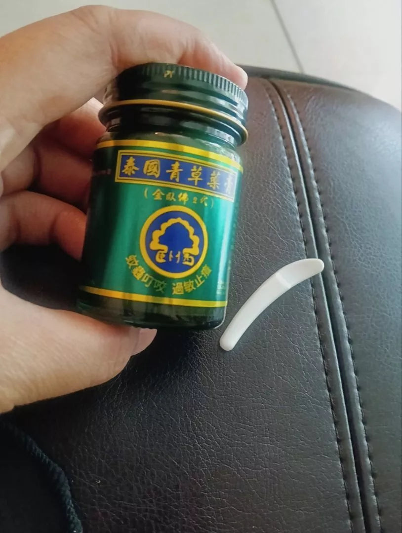 Close-up of Phoyok balm label with Thai and Chinese text