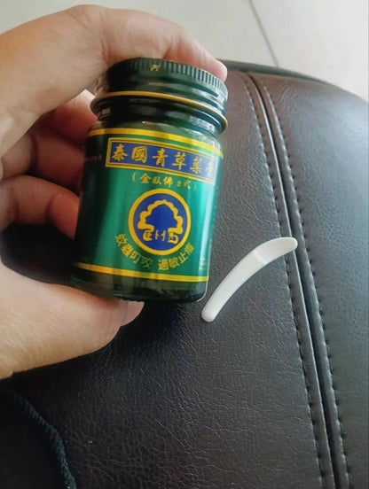 Close-up of Phoyok balm label with Thai and Chinese text