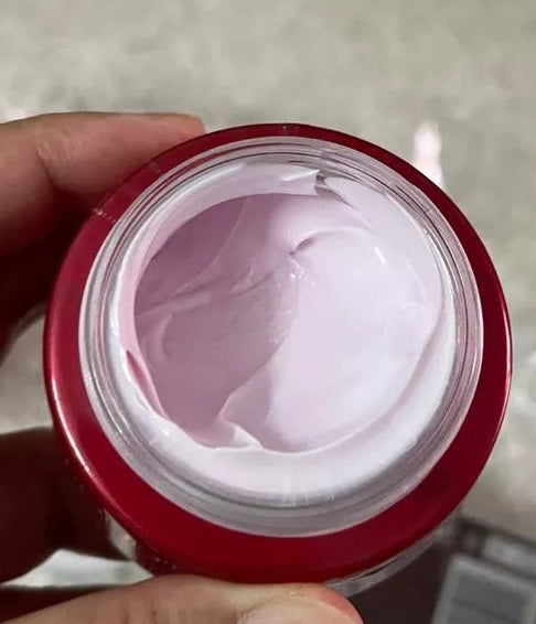 Pond 's Age Miracle Night Cream texture in jar soft pink close up
