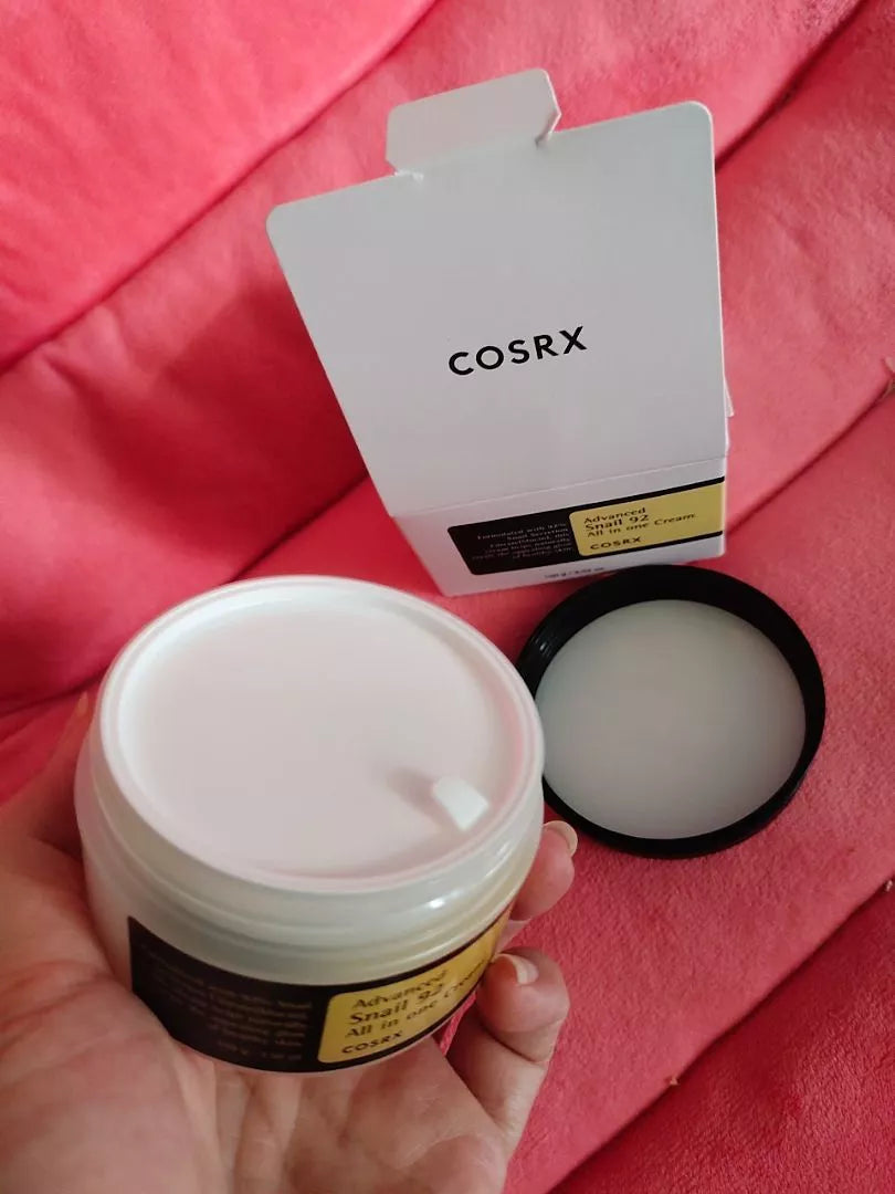 Open jar of COSRX Advanced Snail Mucin 92 All in One Cream with box and lid