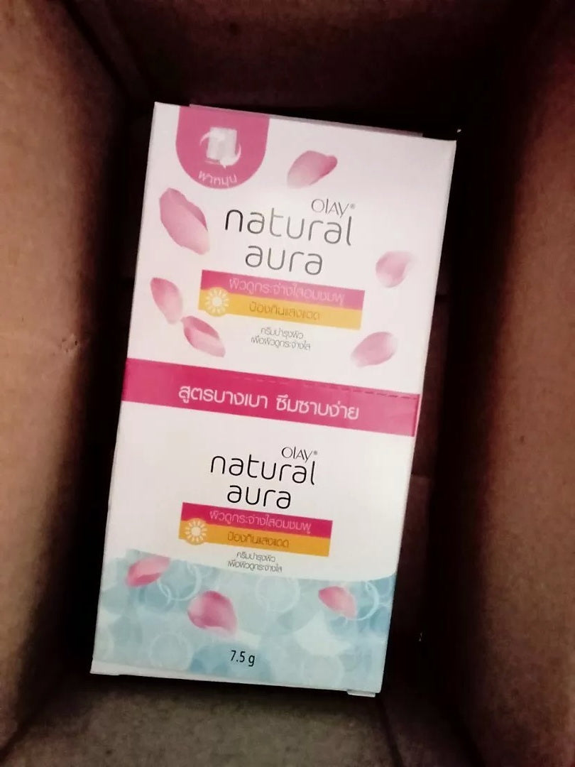 Olay Natural White Pinkish Fairness UV Protection Cream box in packaging, 7.5g sachets, featuring floral design.