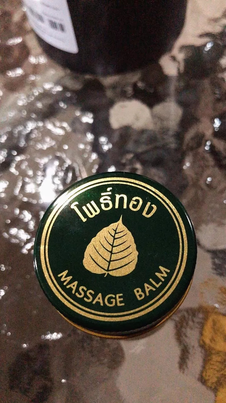 Top view of open Pho Thong Green Herbal Massage Balm jar