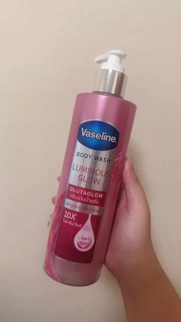 Vaseline Luminous Glow Body Wash handheld bottle usage view
