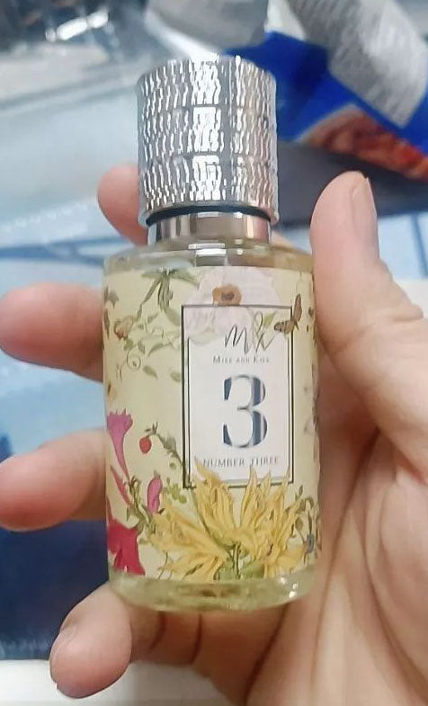 Miss and Kiss No 3 Perfume eau de parfum spray bottle held in hand