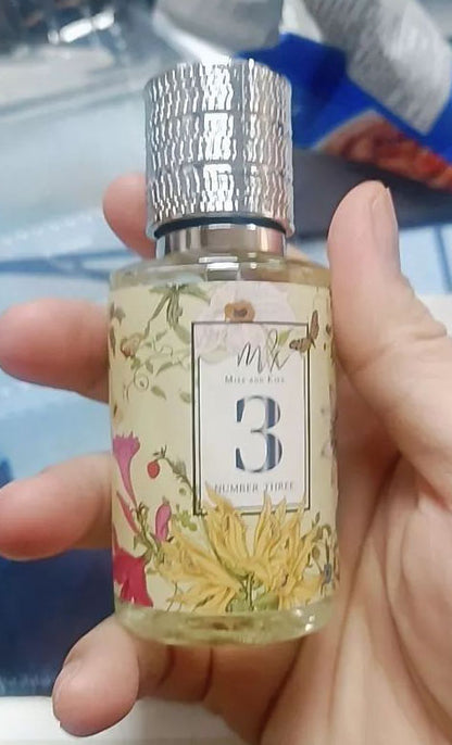 Miss and Kiss No 3 Perfume eau de parfum spray bottle held in hand