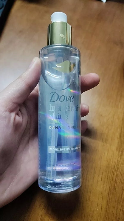 Dove Hya Keratin Oil real product bottle display on surface