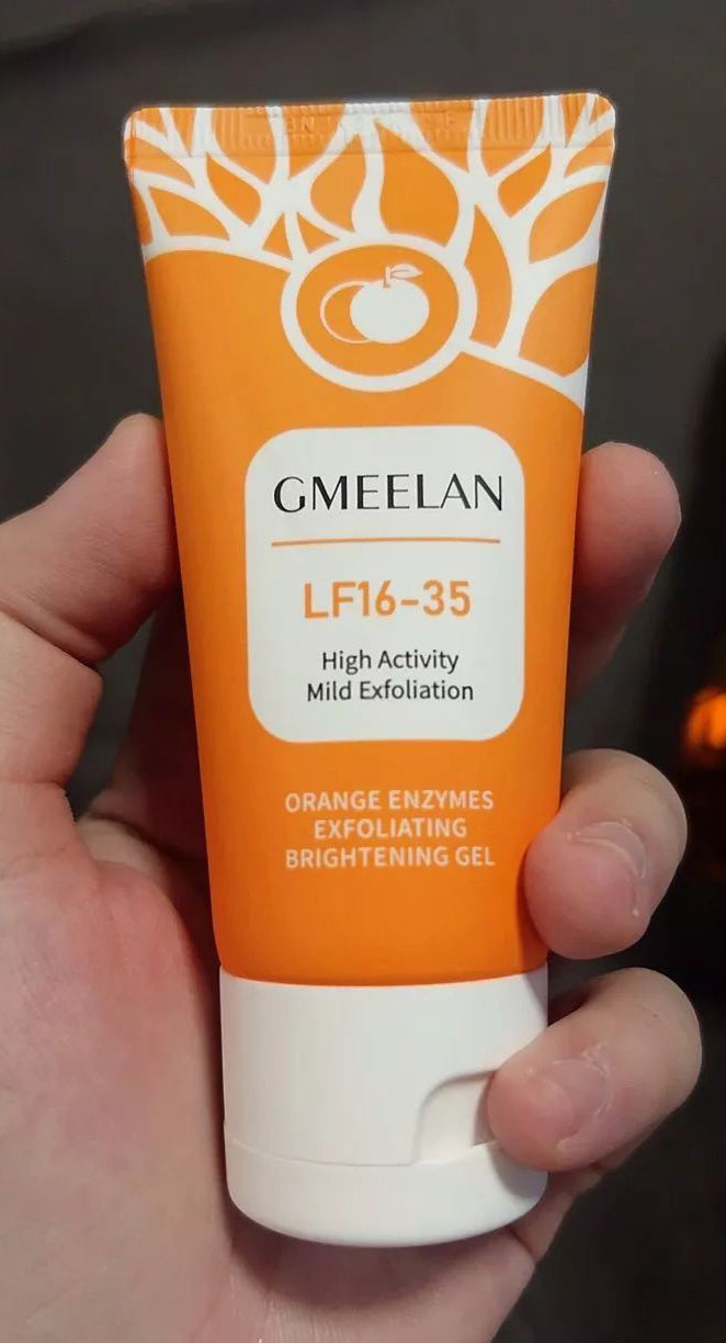 GMEELAN Orange Exfoliating Gel tube held in hand product size reference