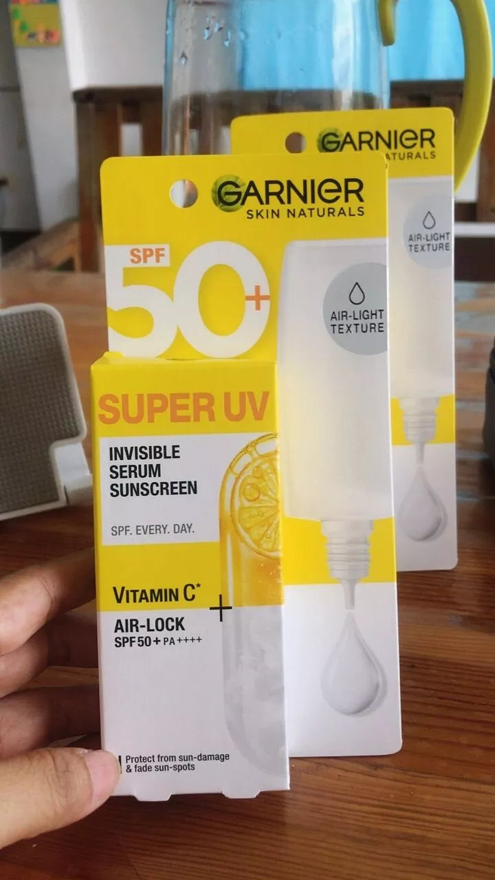 Garnier Super UV Serum sunscreen SPF50 PA++++ product display with box and tube