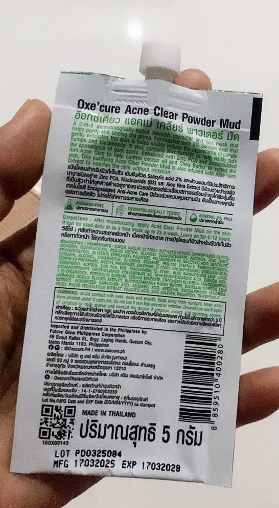Oxe Cure Acne Clear Powder Mud sachet held in hand showing back label details