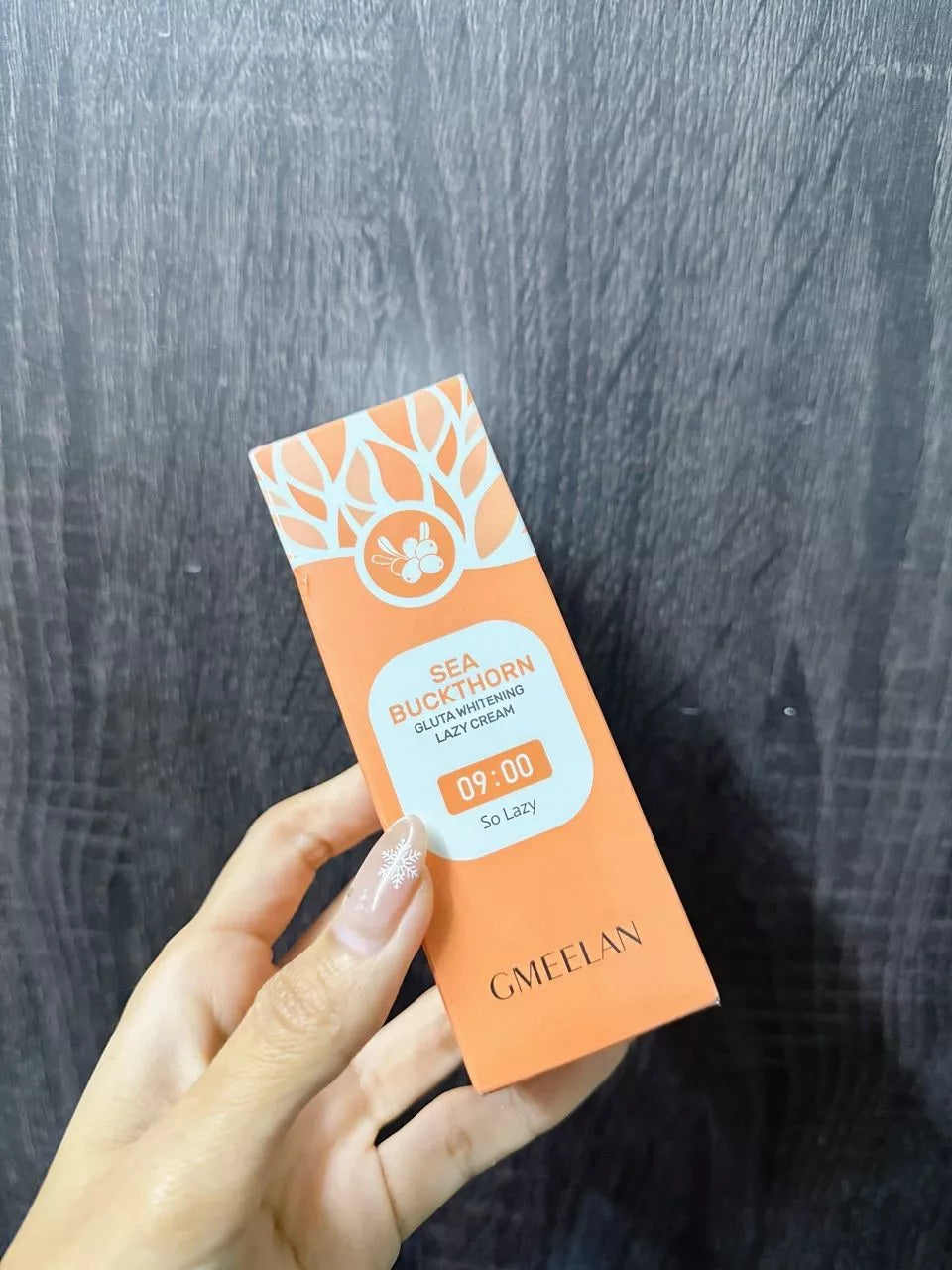 GMEELAN Gluta Lazy Cream tube held in hand showing compact size and design
