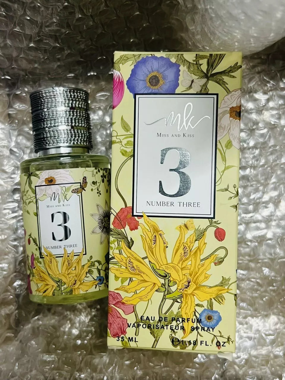 Miss and Kiss No 3 Perfume spray bottle with botanical floral box design