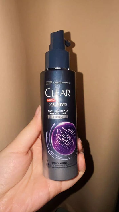 Clear Men Scalp Pro Serum bottle held in hand showing size and usage