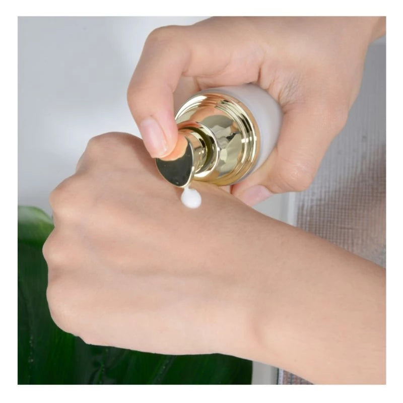 Mistine Time Lock Serum being applied on hand with pump dispenser