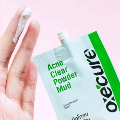Oxe Cure Acne Clear Powder Mud sachet held in hand showing spot treatment powder mud
