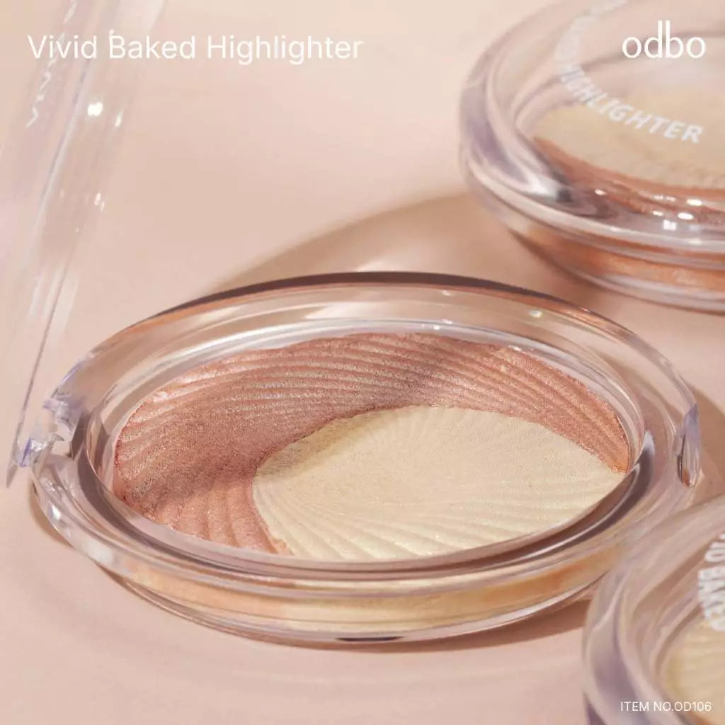 Odbo Vivid Baked Highlighter in clear compact case showing fine shimmer baked powder
