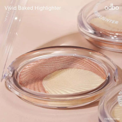 Odbo Vivid Baked Highlighter in clear compact case showing fine shimmer baked powder