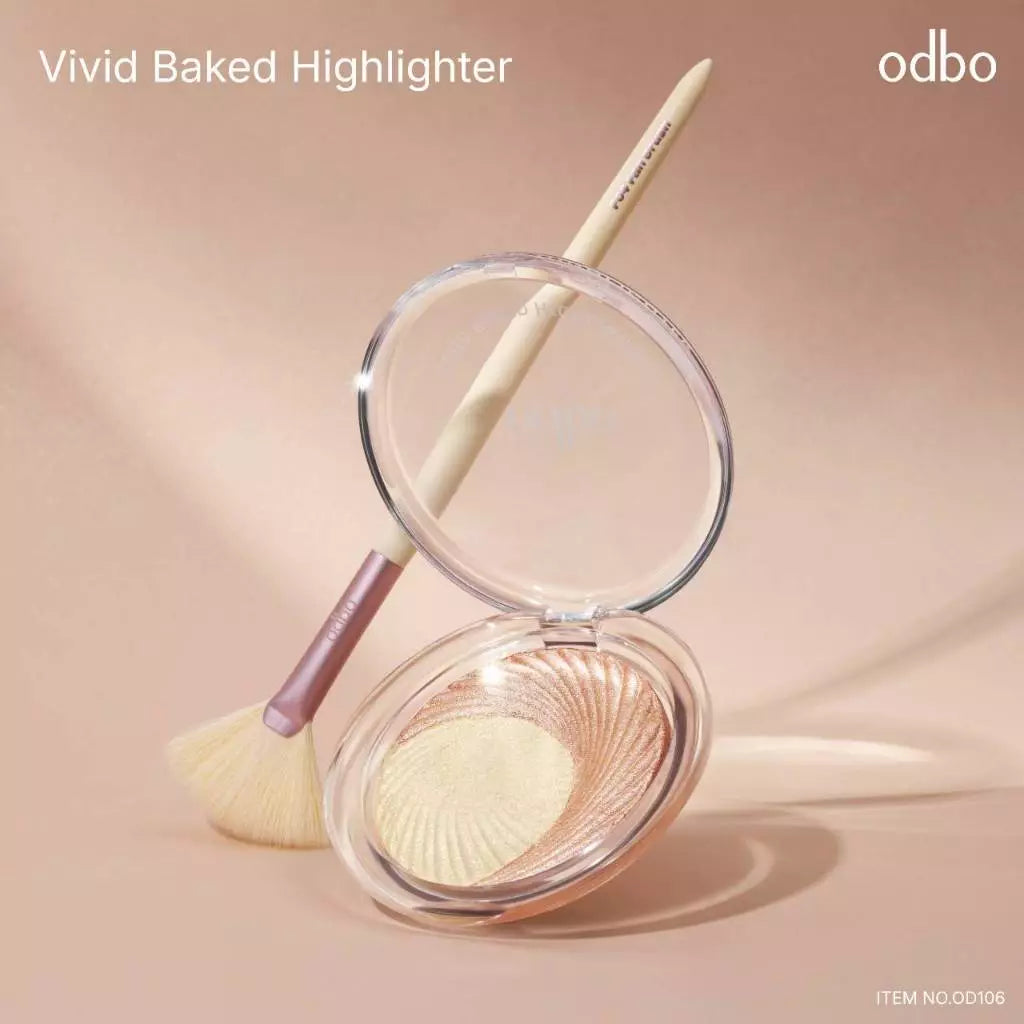 Odbo Vivid Baked Highlighter lifestyle set with makeup brush and open compact case