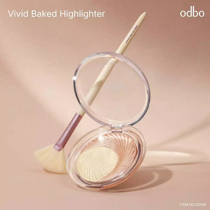 Odbo Vivid Baked Highlighter lifestyle set with makeup brush and open compact case