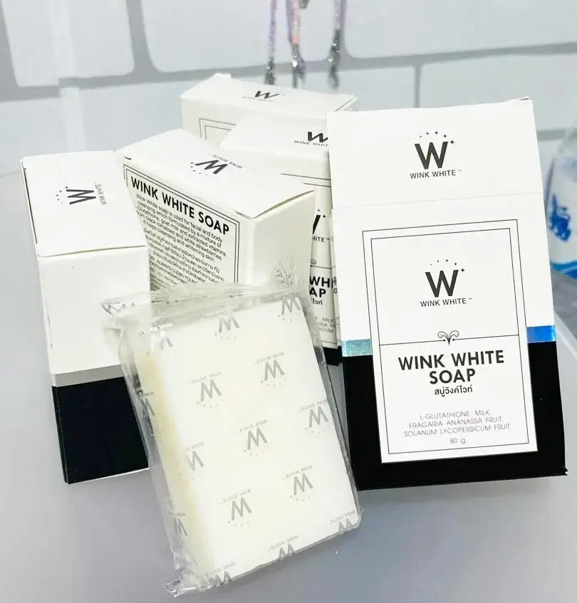 Multiple boxes and wrapped bars of wink white soap displayed together