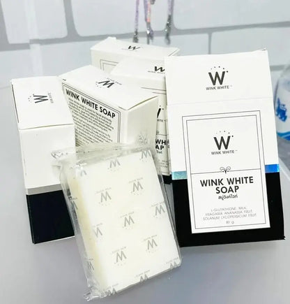 Multiple boxes and wrapped bars of wink white soap displayed together